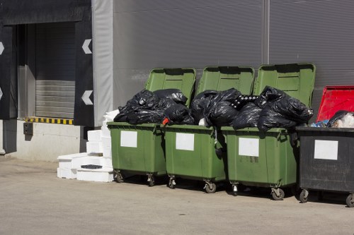 Man and van preparing to remove garden waste from a semi